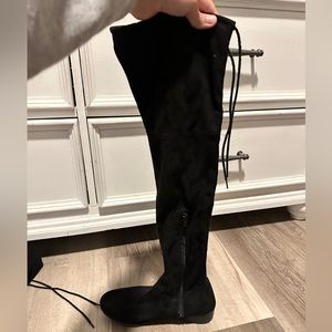 flat black knee high boots with tie on the back